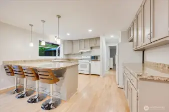 Updated kitchen with eating bar. All appliances stay.