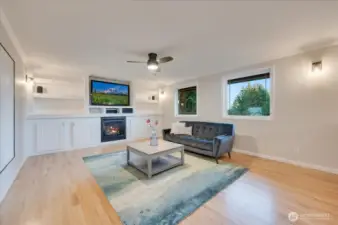 Spacious living room with gas fireplace, built ins and home theater