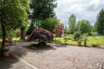 Courtyard overlooking fruit trees flowers and property.