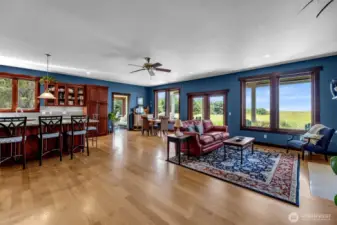 Expansive open plan ocean view great room with access to covered porch and sunroom