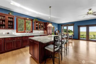 Room for all the beloveds. Casual dining at the island, or larger group in the dining area