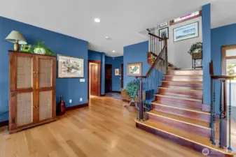 Staircase from great room, foyer on the left.