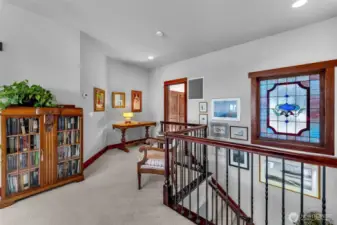Top of the stairs, door to hall to big bonus room and office