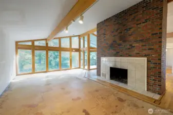 Living room w/fireplace. Carpet has been removed