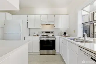 Refreshed kitchen featuring sleek quartz countertops and updated cabinetry.