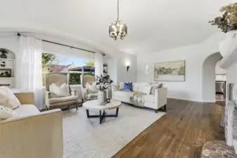 The living room has two walls of expansive windows, inviting abundant light to entr all year long.