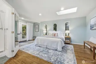The primary suite is truly a sanctuary inviting you to relax and renew. The French doors open to the super spacious patio along the side of this home.