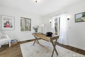 The front bedroom is styled here as a home office.