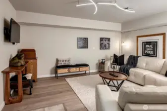 New luxury vinyl wood floors and lighting in bonus room