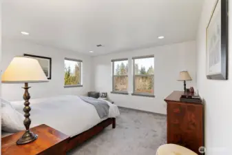 Primary bedroom with Olympic mountain views.