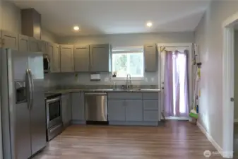 OPEN CONCEPT LIVING AREA OPENS TO THE KITCHEN WITH STAINLESS STEEL APPLIANCES! THE DOORWAY LEADS TO AN OUTSIDE DECK!