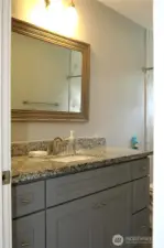 BATHROOM VANITY HAS MATCHING QUARTZ COUNTERTOP!