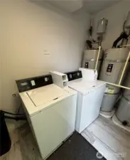 coin-op washers in shared laundry room