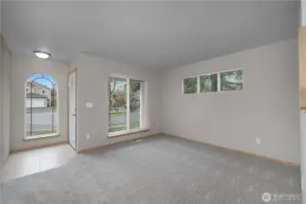 Living room, looking back to front door.