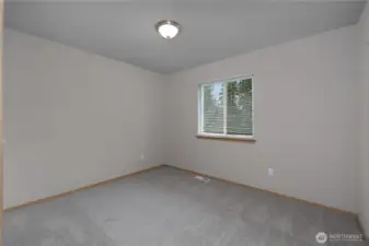Second bedroom, home features brand new carpet!