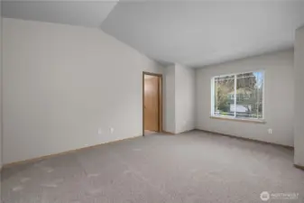 Vaulted ceilings in primary bedroom adds an extra nice touch