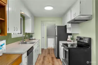 Convenient galley kitchen adjacent to the dining area, making meal prep and dining a breeze.