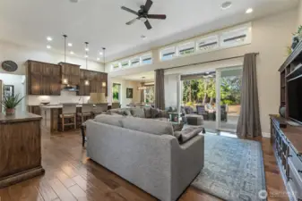 Great room to Kitchen, Dining Room and Double Sliders to Covered Patio with Ceiling Fan