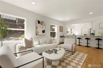 Engineered hardwoods throughout living room, kitchen, and hallway