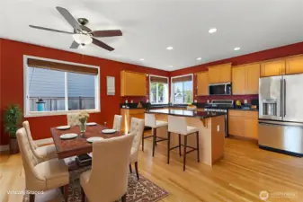 Virtually staged to spark your imagination—this spacious kitchen and eating nook offers endless possibilities. Whether it’s a large dining table for gatherings, a cozy breakfast spot, a creative craft corner or work-from-home setup, plus seating at the center island—there’s room to personalize the space to suit your lifestyle.