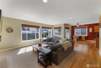 The home features an open floor plan with window coverings, heat pump to keep the home a comfortable temperature year-round, and hardwood floor in the kitchen, separate eating area, entry and hall.