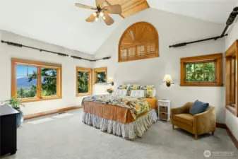 Spacious Primary suite on Upper level offers vaulted ceilings, plenty of natural light & Mt. Rainier & mountain views.