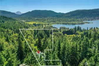 General visual of the size and scope of this 5.049 Acre / 219,939 sq ft lot. The flat space for additional parking or future garage space is in the bottom right most extension.