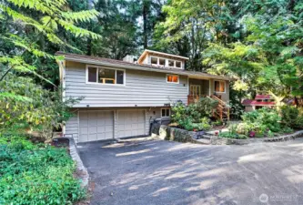Lake Forest Park sanctuary offers forest views, bird song and the soothing sounds of McAleer Creek. Connect with nature but enjoy modern conveniences.