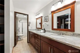 Primary bath has two sinks and a generous countertop.