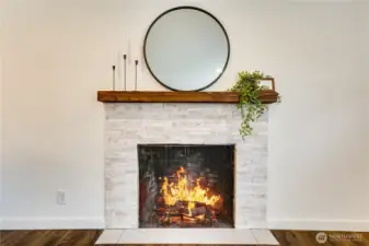 A stunning new fireplace surround and mantel anchor the living room—perfect for cozy fires on crisp autumn nights.