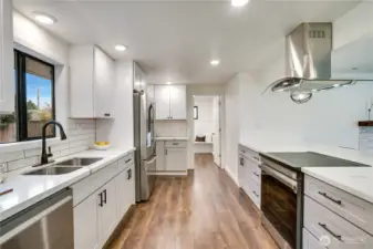 Brand-new kitchen appliances, including a sleek induction cooktop, for effortless precision and modern efficiency.