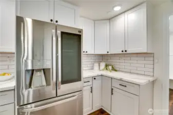 High-tech refrigerator with smart features and sleek design.