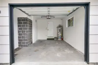 Finished one-car garage with new furnace and water heater for year-round comfort and efficiency.