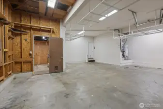 Garage with workshop for crafting, home projects, or organized tool/equipment storage