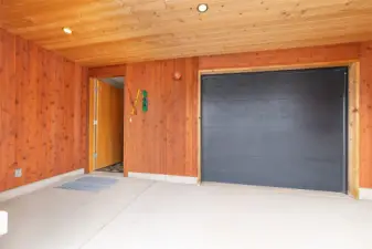 One car heated garage and gear space. Photo from previous listing of the same model of home.