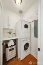 Main floor laundry room with commercial washer and dryer.