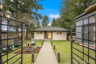 Gated entry from the alley. Just one stair to the main floor of the house.