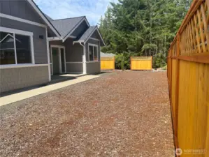 Front of house with privacy fence.