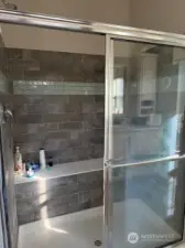 Tiled walk-in shower.