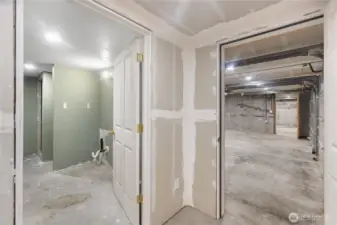 Unfinished hallway & bathroom on garage level