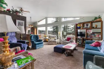 Vaulted ceiling living room as you enter the home