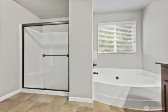 Deep soaking tub & separate shower in primary bath.