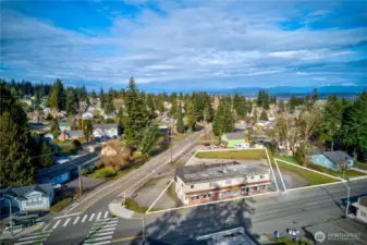 Dynamic mixed-use asset in Everett’s revitalizing urban core. Interurban Crossing spans a 26,572 SF corner lot with alley access, 20+ parking spaces, and a 7,629 SF structure leased to stable local tenants—3 storefronts, 3 apartments, and 3 flex spaces. Current gross rent over $64K; pro forma $144K+ with light upgrades. Just 26.3% lot coverage—NB zoning + Opportunity Zone offer phased development potential. Steps from the Interurban Trail, future light rail, and new stadium district. A walkable, well-connected location with built-in income and big upside.