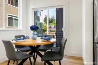 Dining area leading to private balcony.