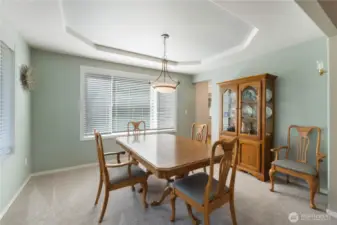 The formal dining room is conveniently situated just off the kitchen, providing a seamless flow that makes entertaining a breeze.