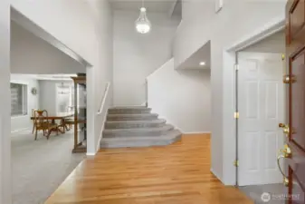 A grand staircase welcomes you to the upper level of the home.