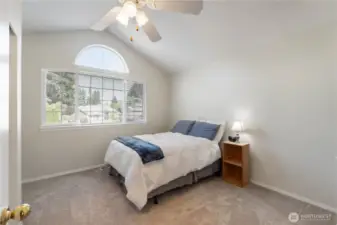 One of two spacious guest bedrooms on upper level.