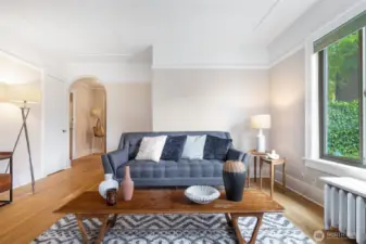 Great wall space for art, another big closet, an arched passageway to the back foyer, kitchen, bedroom and bath.