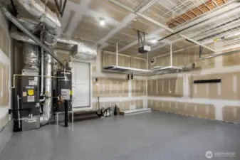 Garage is located directly off the kitchen.  Easy access with groceries etc.  Overhead storage and new epoxy floor.