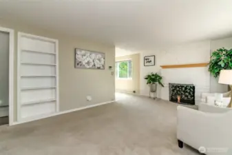 Living room is light and bright and features a fireplace and insulated windows